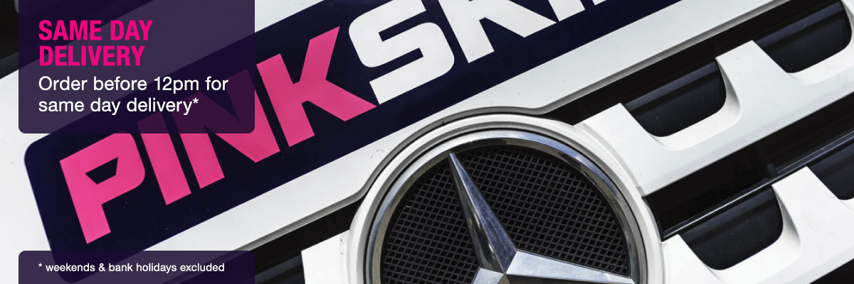 pink skip lorry grille close-up